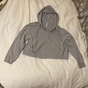 Tablet is quarter zip cropped hoodie